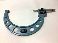 Full micrometer with frame showing size range and brand plate