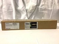 Full shot of sealed cardboard box containing Lexmark C925de Transfer Roll with product labels visible