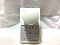 Front view of Siemens medical table control module with circular dial and button panel.