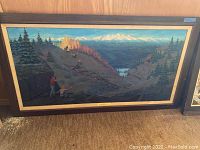Full frontal view of framed landscape painting showing overall composition and frame.
