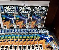 Fifteen identical Cloak and Dagger comic books arranged on a surface, showing front covers.