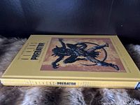 Side view showing the hardback spine with title and author information.
