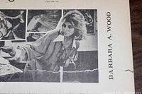 Black and white photo showing Barbara A. Wood's name and a black and white photo of her working on art.