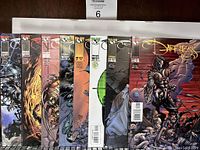 Eight comic books in sequence from The Darkness Volume 1 (issues #11, 12, 13, 15, 18, 19, 21, 22) by Image Comics, showing their covers and condition.
