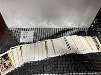Photo showing a large spread of Upper Deck 1991-92 NBA basketball cards laid out, visible white bordered cards with player images and details.