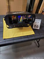 Front three-quarter view of Martin Raptor on yellow cloth with lot marker