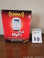 Boxed XM Satellite Radio MyFi receiver showing product branding and box condition