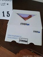 White Steiner Germany branded cardboard box on wooden desk