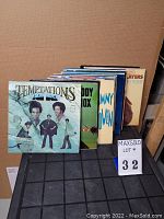 Front row of vinyl records including The Temptations and others showing album cover art
