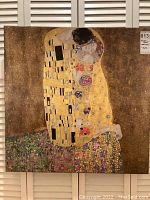 Front view of the 27x27 inch canvas print showing Gustav Klimt's The Kiss artwork with bright gold and floral motifs.