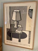 Framed Roy Lichtenstein color screenprint poster featuring stylized table lamp and open book graphic in black, white, and grey tones, text at bottom reading 'The Poetry Project 1988 Symposium Poetry of Everyday Life April 7-10'.
