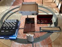 Overall lot displayed on glass table showing all items together
