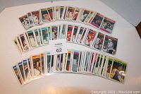 Hockey card singles fanned out, showing multiple player card fronts in soft sleeves.