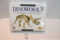Front view of the sealed Dinowork Eyewitness Kits box showing the 15 inch Triceratops skeleton model illustration and product title.