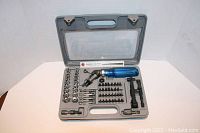 Full open case showing all contents of 61-piece 3-way ratchet screwdriver and socket set.