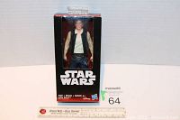 Front view of the boxed Han Solo figurine, showing Star Wars branding and glimpse of the figure inside the unopened packaging.