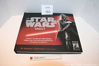 Front cover of The Star Wars Vault book featuring Darth Vader and title