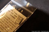 Photo of the 1 gram Valcambi Suisse silver bar in resealable plastic bag with product information insert shown clearly.