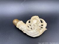Full view of the carved meerschaum eagle claw tobacco pipe showing detailed claw shape and wooden mouthpiece