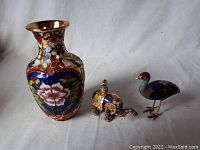 Full view of the three cloisonné miniatures: vase, elephant, and emu.