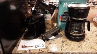 Photo of Mr. Coffee coffee maker with glass carafe and Mr. Coffee Easy Color Coded Measuring System box on a countertop.