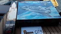Photo showing two vintage model kits in original boxes: NASA Space Shuttle and Valkyrie 2 Rocket