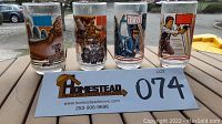 Four drinking glasses featuring Star Wars Return Of The Jedi scenes from Burger King and Coca Cola promotion, front view.