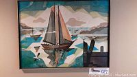 Front view of framed Stareck print depicting sailboat in harbor.