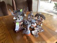 Overview of all seven resin eagle figures displayed on table