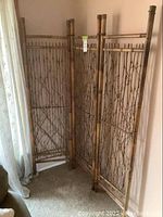 Three photos showing the three-panel rattan room divider positioned in a corner near a window, highlighting the woven rattan and leather paneling details.