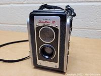 Front view of the Kodak Duaflex III camera showing the twin lenses and camera branding.
