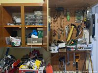Wide view of pegboard with hand tools and cabinet with hardware items on shelves.