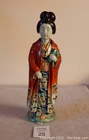 Front view of the Japanese noblewoman porcelain statue showing detailed kimono and facial features.