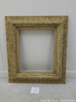 Full view of the antique gilded and carved frame showing its outer dimensions and overall condition.