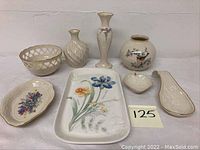 Photo showing full lot of ceramic pieces arranged: rectangular floral tray, vases, ladle, reticulated bowl, trinket dishes.