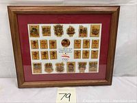 Framed set of 23 U.S.A Dream Team Barcelona 1992 Olympic buttons arranged on a red matte with white border inside wood frame