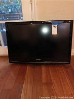 Front view of the Sylvania LD320SSX television showing the screen and surrounding black bezel.