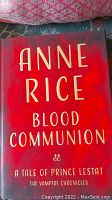 Front cover of the Anne Rice Blood Communion first edition hardcover book, showing the red cover with gold lettering.