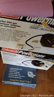 Box of Coleman Powermate air compressor showing product details including 260 PSI rating and included components.