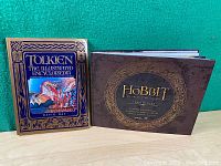 Photo of two books: Tolkien The Illustrated Encyclopedia and The Hobbit Chronicles, showing front covers together