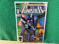 Front cover view of The Punisher #1 comic book showing title and main character in urban action scene.