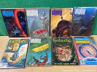 Group of nine vintage science fiction magazines including Analog, Fantastic, and Fantasy Arts. Covers show varied sci-fi themes including spaceships and monsters.