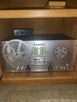 Pioneer reel-to-reel tape deck in wooden cabinet