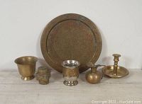 Photo showing all six items: large plate, candle holder, pitcher, goblet, urn, and container