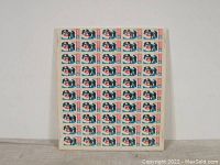 Full view of the 50 stamp sheet featuring the 6 cent 1969 Canadian curling stamp with plate blocks on the right side.