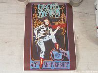 Signed 40th anniversary tour poster with cowgirl illustration and decorative font.