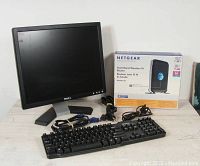Dell monitor, keyboard, Netgear router with box and cables