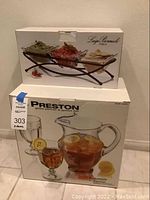 Boxed set of Preston glass pitcher with 8 goblets and boxed Luigi Bormioli condiment server