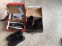 Overview of four pairs of casual shoes including Nike brand in boxes and outside, showing brand labels and color details.