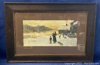 Full view of the framed watercolour showing a winter landscape with people and a snowy cabin near water.